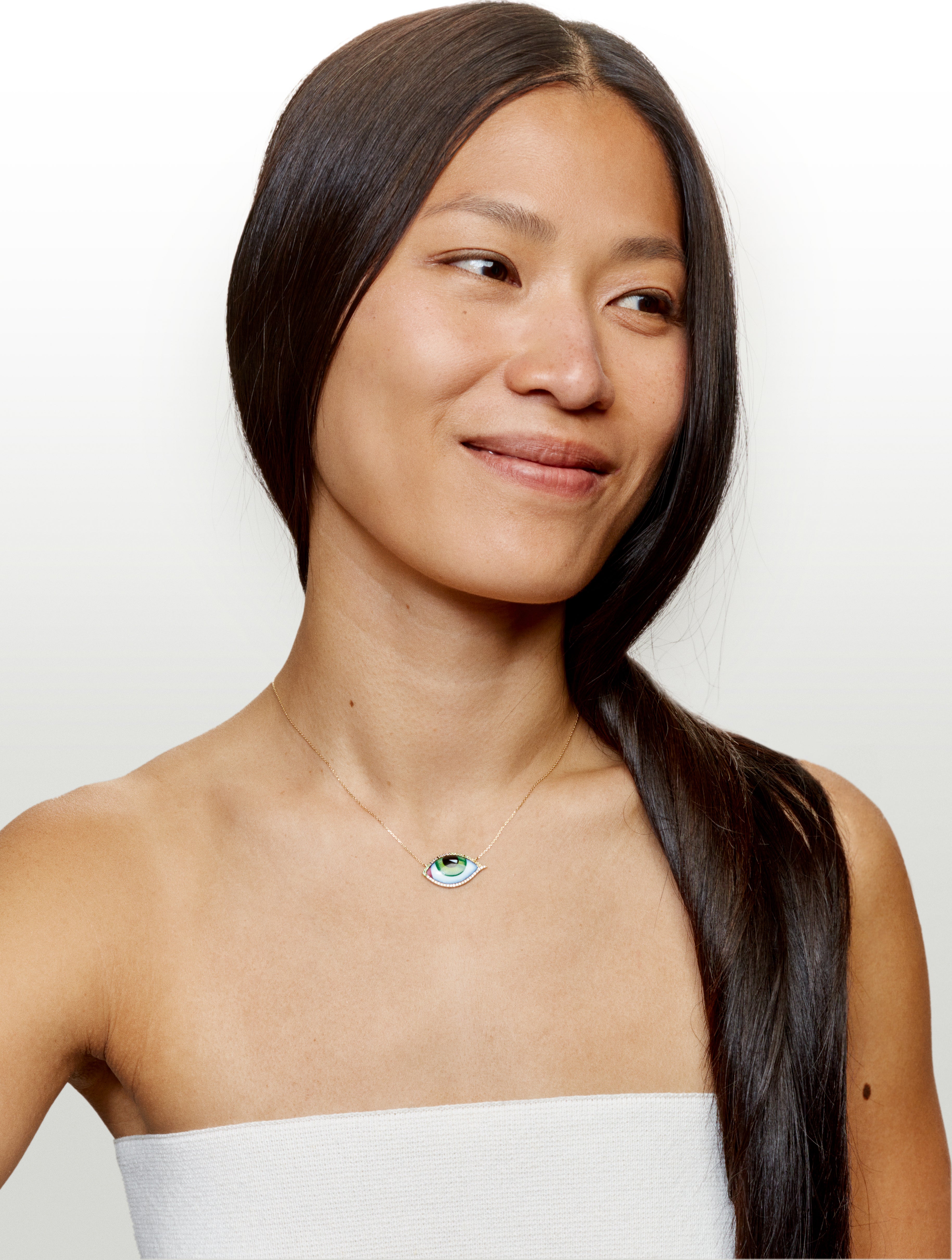 Yellow gold and diamond eye necklace