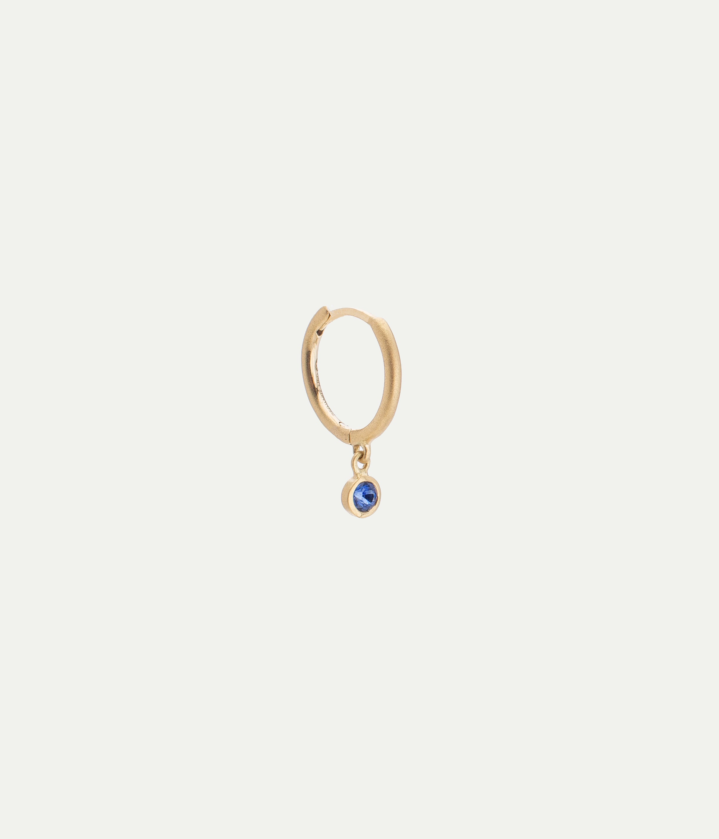 Ada matte yellow gold and blue sapphire hoop